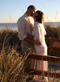 Newly Married Couple kissing at Clearwater Beach